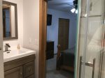 Guest bedrooms share access to a jack/jill bathroom with a walk in shower